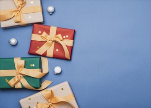 Colorful presents with ribbon blue background