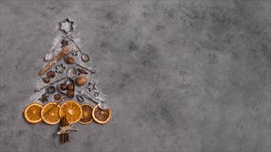 Top view christmas tree shape made dried citrus kitchen utensils. Resolution and high quality beautiful photo