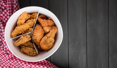 Top view fried chicken bucket with copy space kitchen towel. Resolution and high quality beautiful photo
