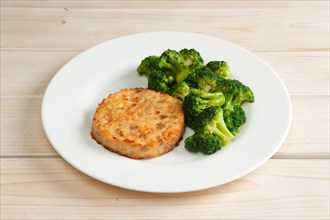 Meat cutlet with cheese and broccoli