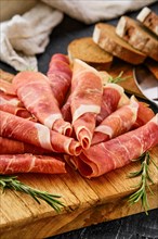 Close up view of rolled slices of jamon