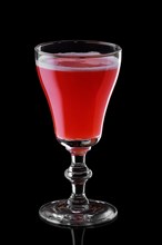 Glass of strawberry daiquiri cocktail isolated on black background background