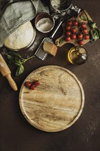 Top view pizza dough with wooden board tomatoes. Resolution and high quality beautiful photo