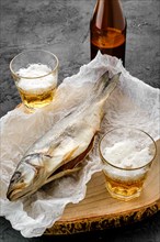 Whole jerky sea bass and a beer