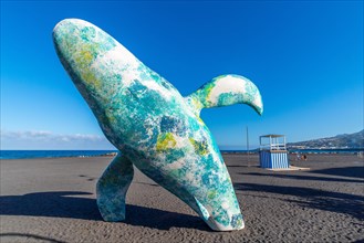 Modern sculpture of a whale