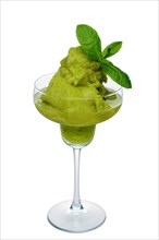 Kiwi smoothie in wide glass decorated with mint leaves isolated on white