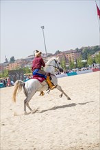 Ottoman horseman in his ethnic clothes riding on his horse