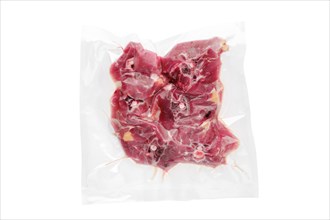 Vacuum sealed lamb neck meat isolated on white