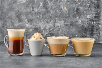 Variation of coffee drinks on shabby background