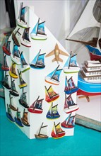 Set of small colorful model sailboats