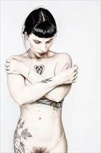 Naked Young Woman with Tattoos