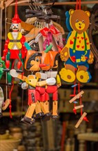 Set of wodden puppet Pinocchio in outdoor bazaar