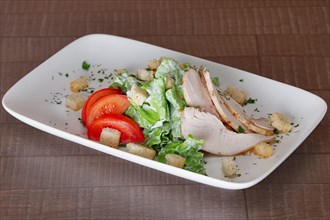 Vegetable salad with fried chicken meat. Greek salad