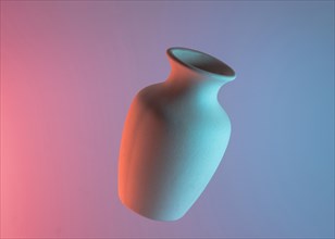 White plain ceramic vase air against colored blue pink backdrop. Resolution and high quality beautiful photo