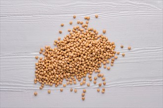 Top view of pile of soya beans on wooden table