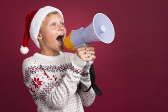 Christmas boy shouting through megaphone