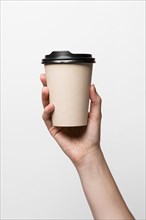 Close up hand holding coffee cup