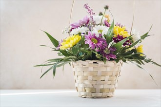 Flower composition wicker basket table