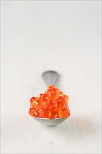 Spoon with salmon red caviar