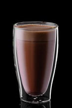 Double wall glass of hot chocolate isolated on black background