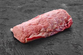 Raw fresh pork collar joint meat on black background
