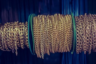 Rolls of metal chains as a background texture