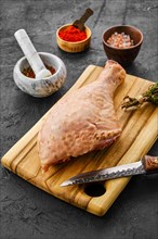 Raw fresh turkey drumstick with spices