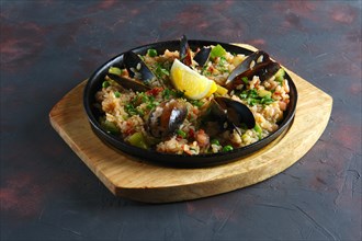 Traditional spanish paela with shrimps and mussels