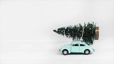 Car toy with fir tree top