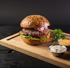 Tasty cheeseburger wooden board ready be served. Resolution and high quality beautiful photo