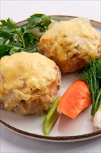 Cutlet covered with melted cheese served with fresh carrot