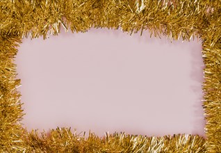 Golden tinsel frame with pink background