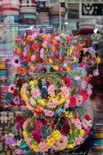 Colorful crowns for sale made of fake flowers