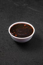 Small bowl with spicy teriyaki sauce