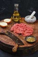 Old fashioned style of making fresh raw beef mince meat with chopping knife