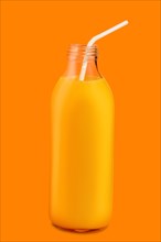 Small bottle with orange juice with straw