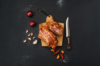 Air dried lamb neck meat on wooden cutting board