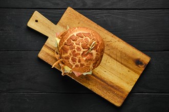 Overhead view of large burger with pulled beef