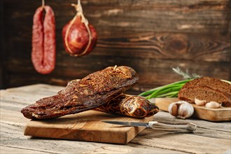 Air dried beef meat on wooden cutting board