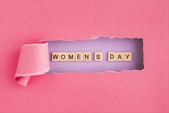 Women s day written in scrabble letters and torn paper. Resolution and high quality beautiful photo