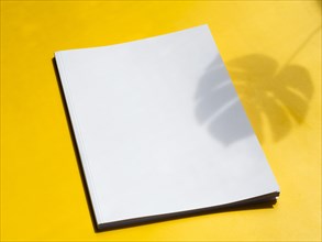 Close up blank magazine with yellow background