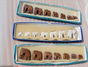 Set of figurines of elephants made of marble in box
