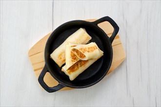 Thin pancakes stuffed with rabbit meat