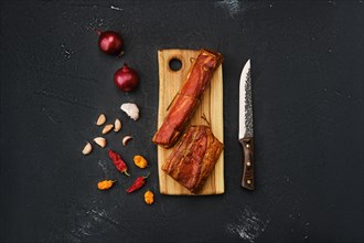 Smoked lamb meat on wooden cutting board