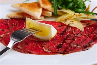 Closeup view of beef carpaccio with cheese