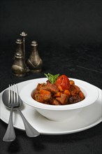 Lamb stew with tomato on a plate
