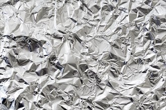 Crumpled silver aluminium foil background