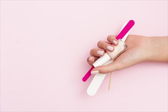 Woman holding manicure tools with copy space. Resolution and high quality beautiful photo