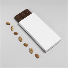 High angle blank chocolate bar package with nuts copy space