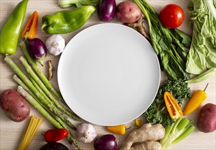 Top view assortment veggies with empty plate. Resolution and high quality beautiful photo